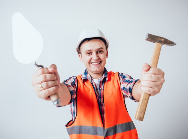 The young man making repairs to their home