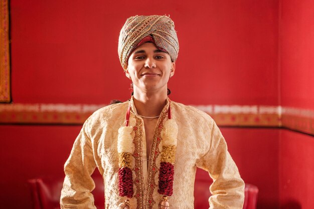 Young man at a marriage ceremony ready to join Concept religion Hindu