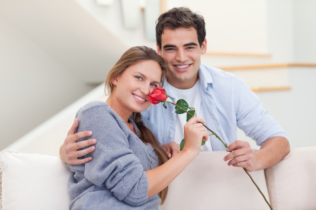 Young man offering a rose to his girlfriend