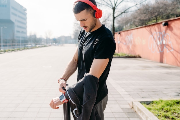 Young man outdoor listening music