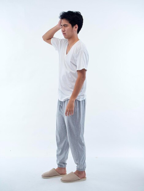 Photo young man in pajamas on white background