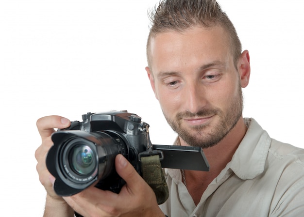 Young man photographer isolated on a white 