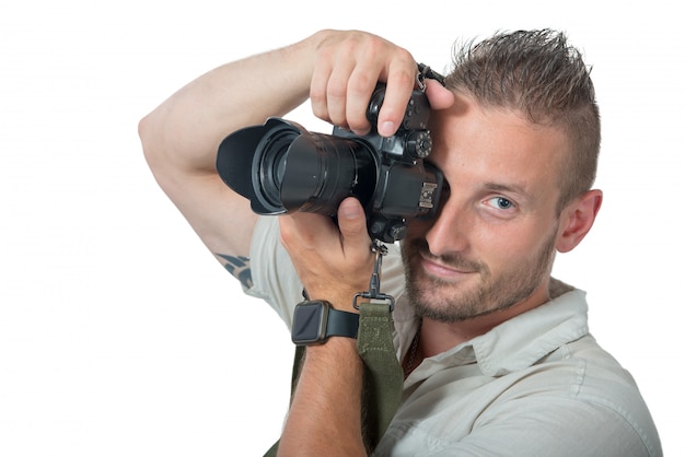 Young man photographer isolated on white 