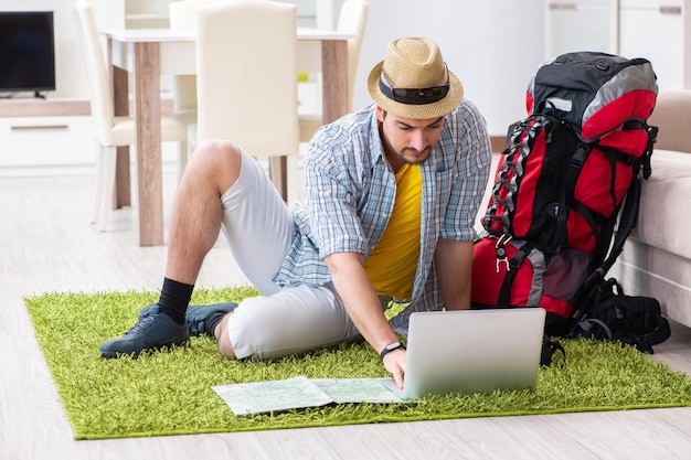 Young man planning his travel online