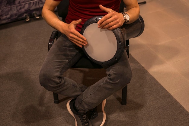 Young man playing drum