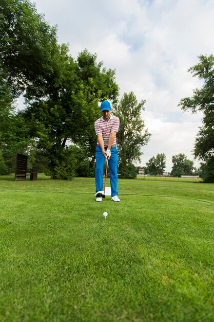 Young man playing golf