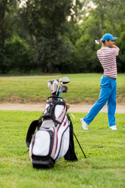 Young man playing golf