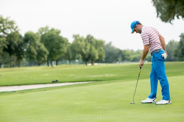 Young man playing golf