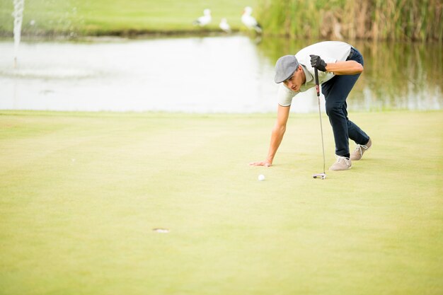 Young man playing golf