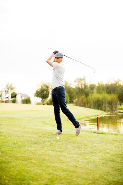 Young man playing golf