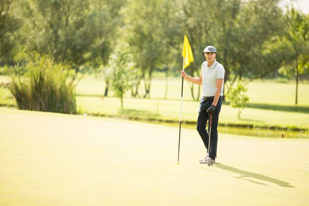 Young man playing golf