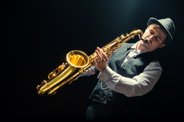 Young man playing the Saxophone