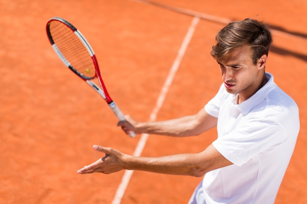 Young man playing tennis