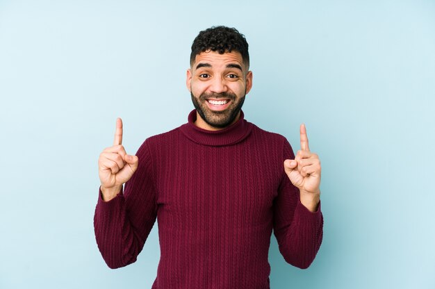 Young man pointing up