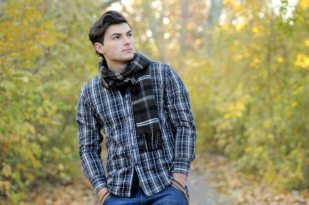 Young man portrait in park.