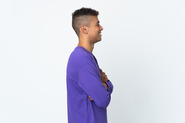 Young man posing isolated against the blank wall