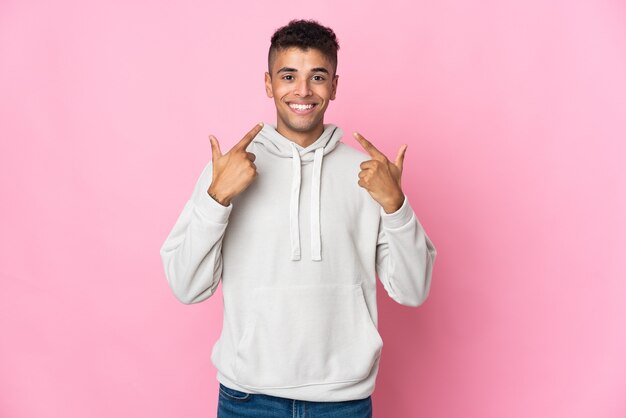 Young man posing isolated against the blank wall