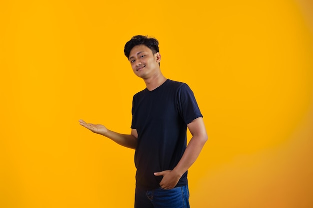 young man posing making choices with one hand raised up