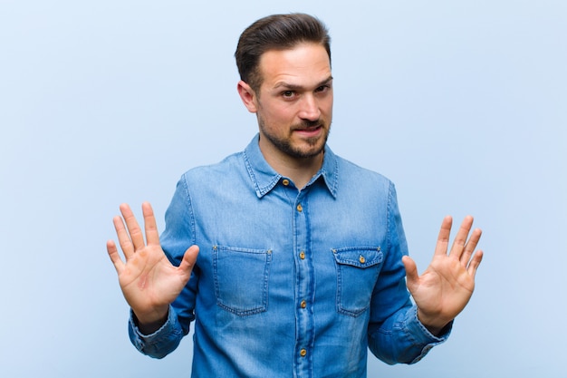 a young man posing while showing he did not do it