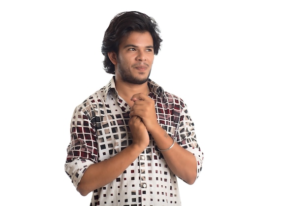 Young man posing on a white