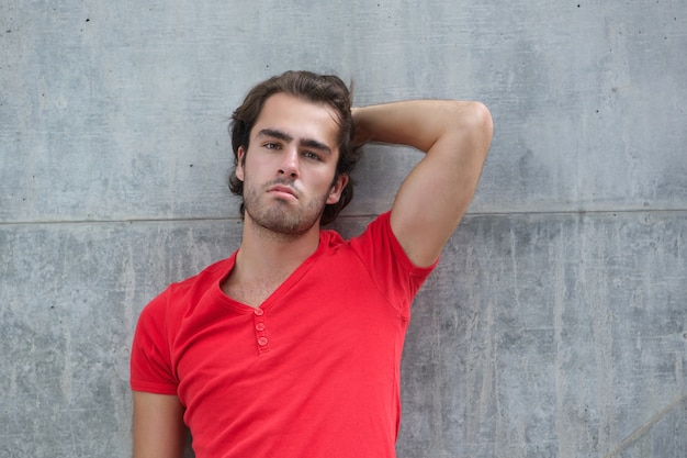 Young man posing with hand in hair