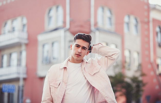 Young man posing with a trendy outfit