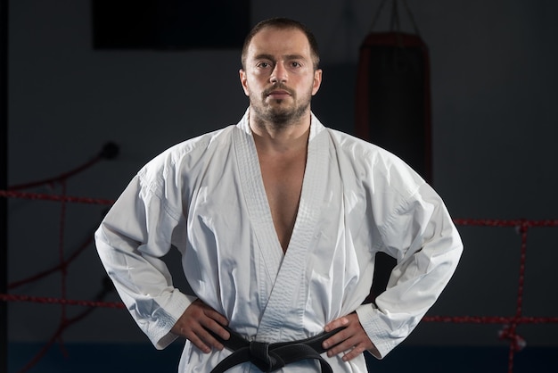 Young Man Practicing His Karate Moves  White Kimono  Black Belt