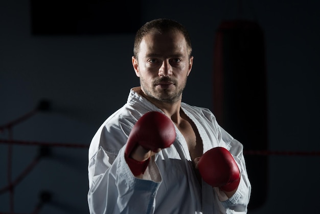 Young Man Practicing His Karate Moves  White Kimono  Black Belt