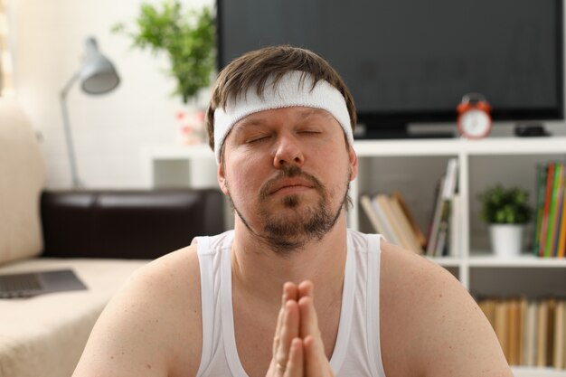 A young man practicing yoga and Pilates