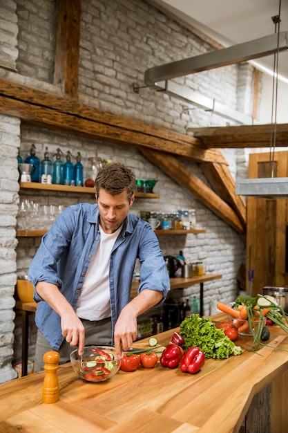 Young man preparing food in the kitchen