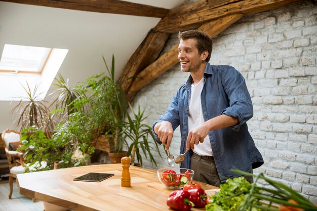 Young man preparing food in the kitchen