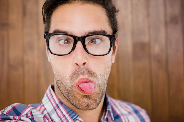 Young man pulling funny faces