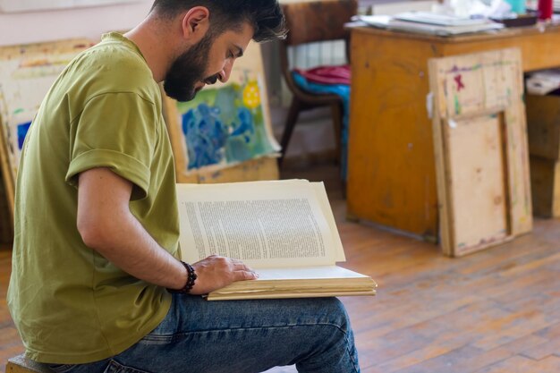 young man reading a book man reading a book