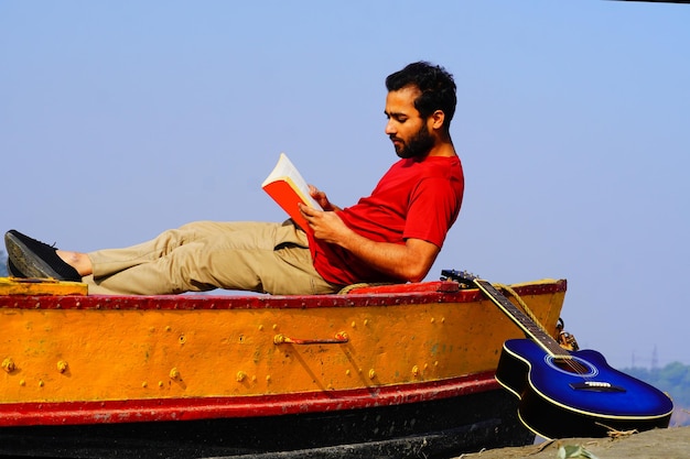 Young man reading a book