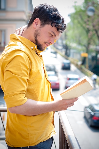 young man reading book 