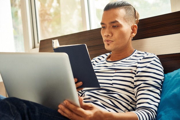 Young man reading book