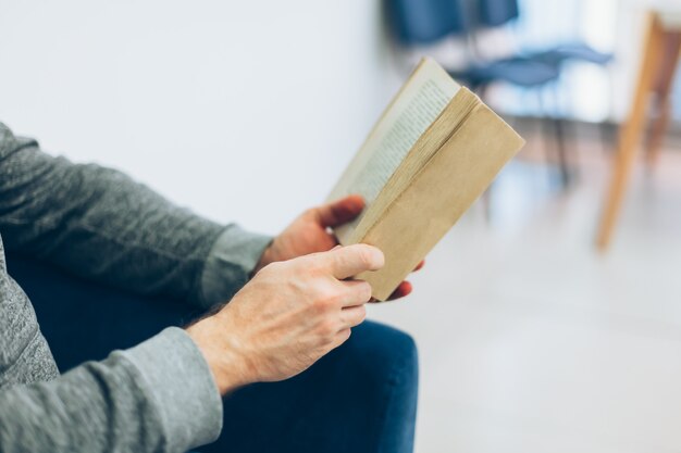 Young man reading a book