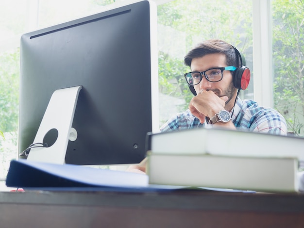 Young man relax at home with earphone 