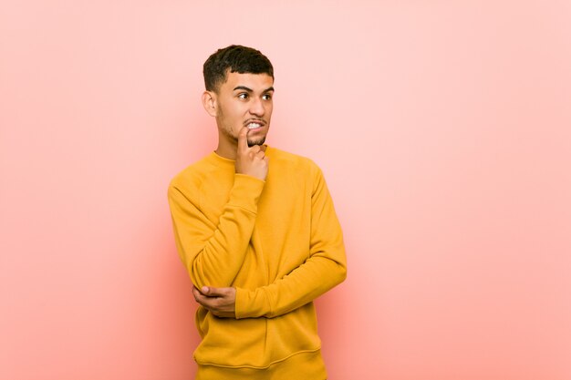 Young man relaxed thinking about something