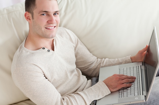 Young man relaxing with a notebook