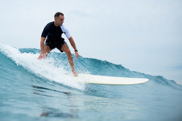 Young man rides the waves