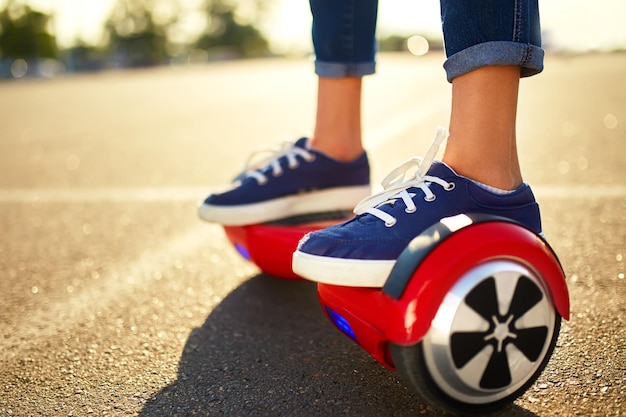 Young man riding on Hoverboard in park content technologies a new movement Self Balancing Electric