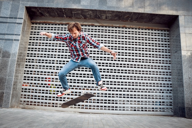 Young man riding a skateboard.