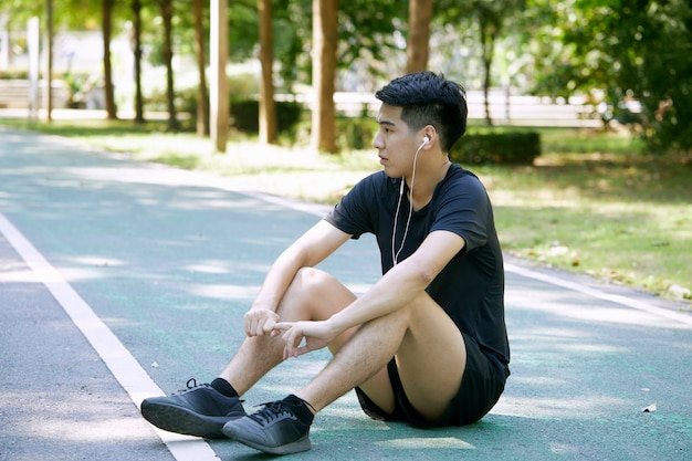 A young man running in the park