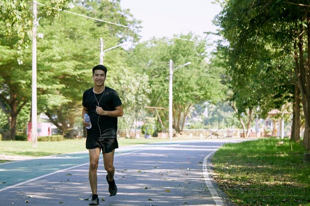 A young man running in the park