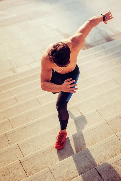 Young man running on stairs