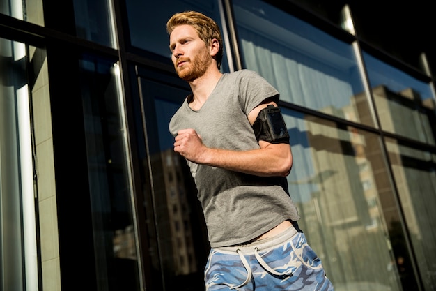 Young man running in the urban area