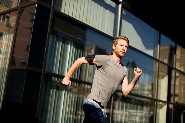 Young man running in the urban area