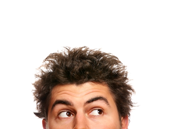 a young man's face looking up over white background