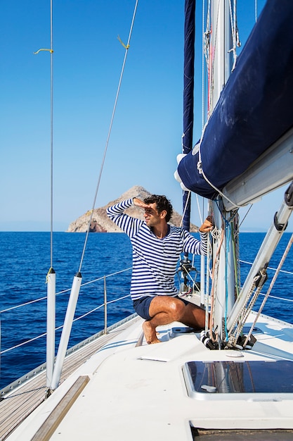 Young man on sailboat